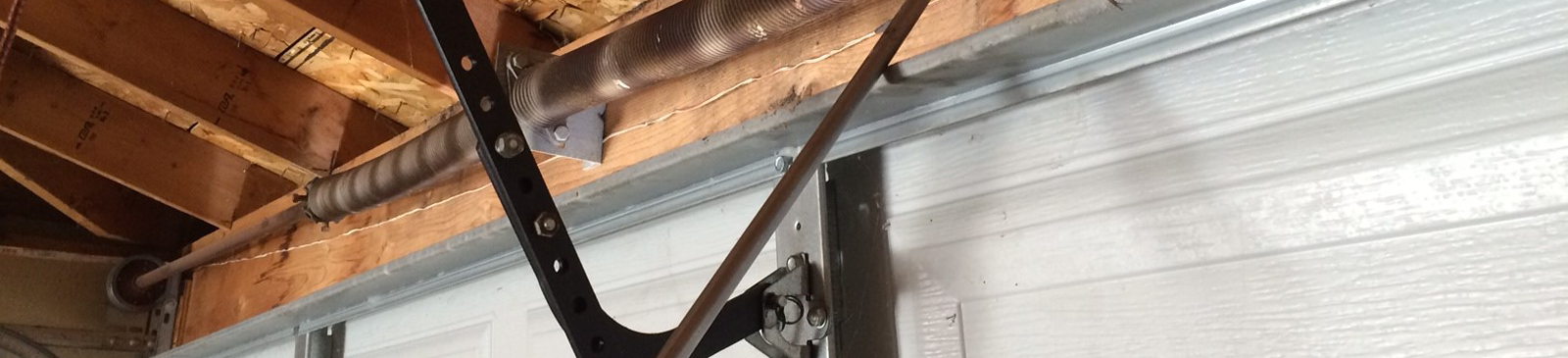 View of sectional garage door with new cable and track installed in Dallas, GA
